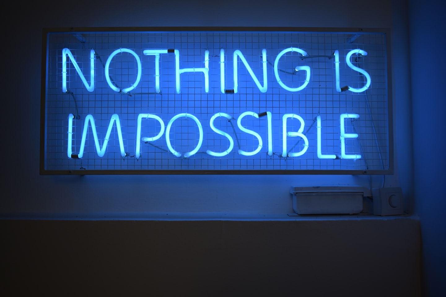 Nothing Is Impossible blue neon sign