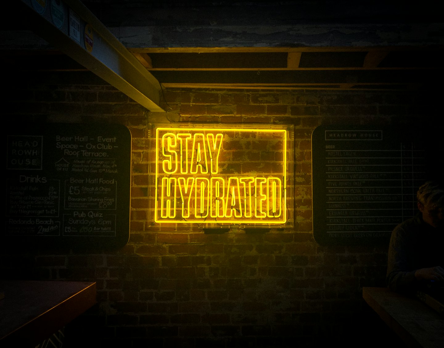 Stay Hydrated yellow neon sign